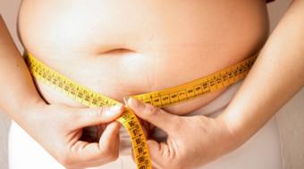 measuring fat tummy