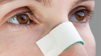 woman bandage on nose