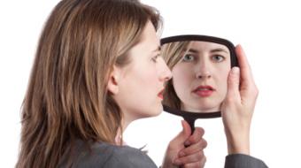 women looking mirror